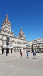 Low angle view of church against clear blue sky