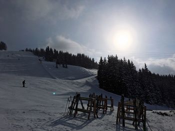 Scenic view of snowy landscape against sky during winter