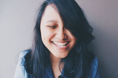 Close-up of smiling young woman