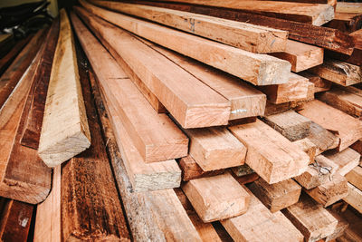 Full frame shot of wooden logs in forest