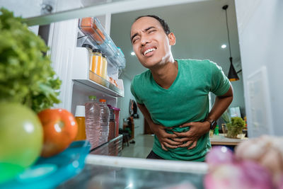 Portrait of smiling man having food