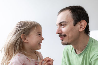 Father and daughter together. daddy at home. young caucasian man with his little girl
