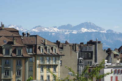 Houses in town against clear sky