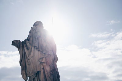 Low angle view of statue against sky