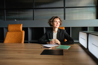 Young businesswoman working at office