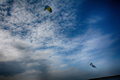 Low angle view of airplane flying in sky