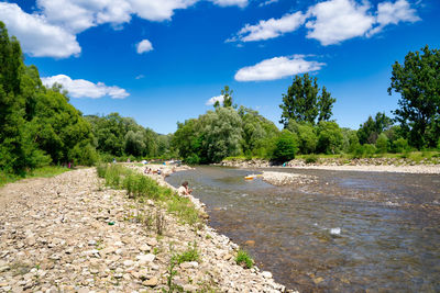 Scenic view of river sola against sky in bielsko biala, south poland 