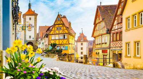 Panoramic view of buildings in city against sky