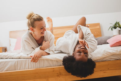 Young woman sleeping on bed at home