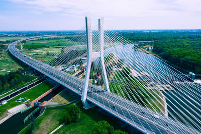 High angle view of highway by bridge against sky