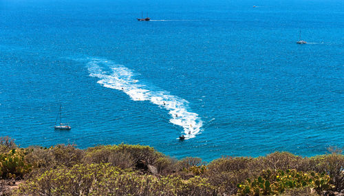 High angle view of boat sailing in sea