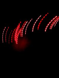 Close-up of illuminated red lights at night