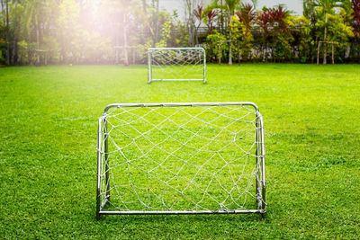 Soccer field against green plants