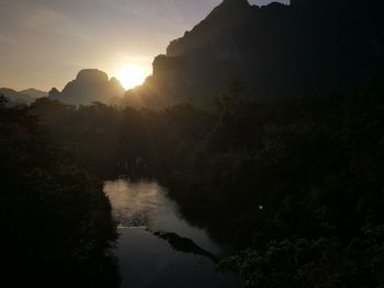 Scenic view of silhouette mountains against sky during sunset