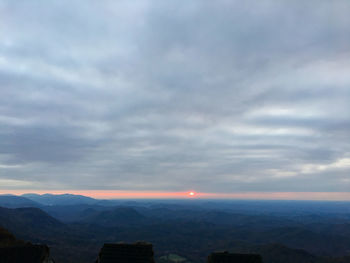 Scenic view of mountains against sky during sunset