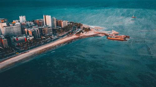 High angle view of city by sea