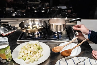 Midsection of man preparing food in kitchen