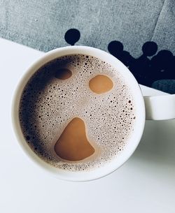 High angle view of coffee cup on table