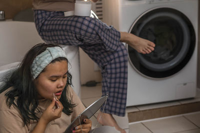 Dawn of wellness, asian girls nurture with careful morning routine. removal of antennae of teenager