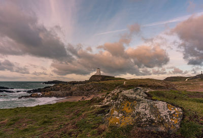 The llanddwyn island lighthouse, twr mawr at ynys llanddwyn on anglesey, north wales at sunrise.