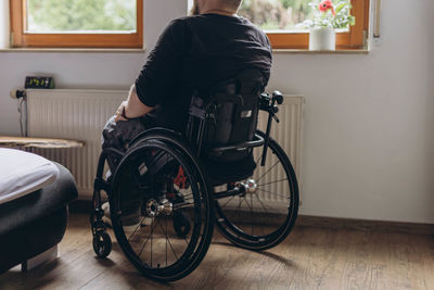Rear view of man riding bicycle