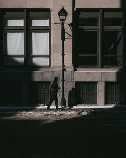 Rear view of man walking on street