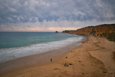 Scenic view of beach against sky during sunset