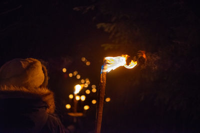 Torchlight procession awaiting christmas in the mountains of val serina