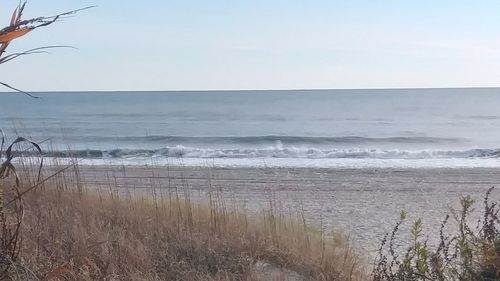 Scenic view of sea against clear sky