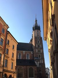 Low angle view of historic building against blue sky