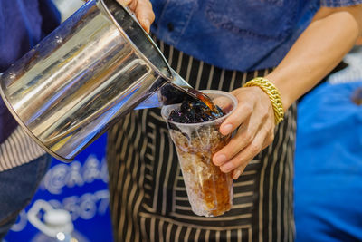 Close-up of hand holding iced coofer