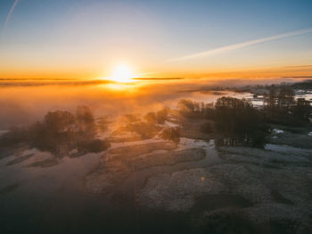 Scenic view of landscape against sky during sunset