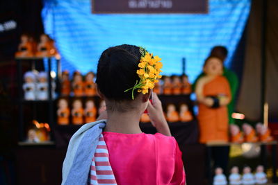 Rear view of girl wearing flowers on head