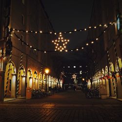 Empty illuminated street lights at night