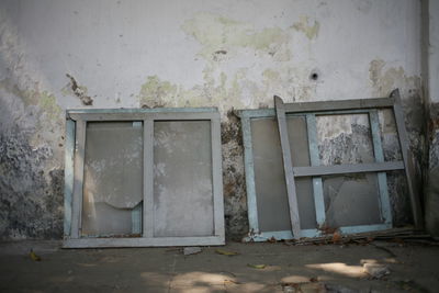 Damaged window of abandoned building
