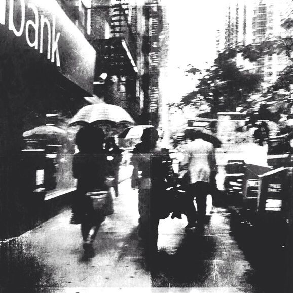 WOMAN STANDING ON CITY STREET