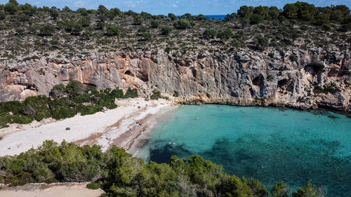 High angle view of rocks by sea