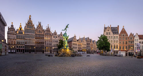 Panoramic view of buildings in city against sky