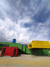 Low angle view of hut on beach against sky