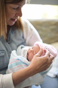 Midsection of mother holding baby girl