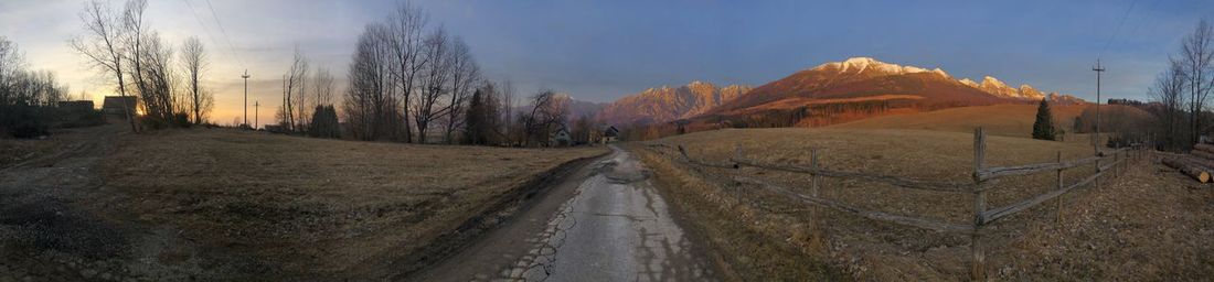 Road amidst landscape against sky