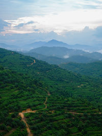 Rural scenery with mountain range background in gua musang, kelantan, malaysia.