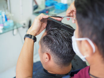 Hairdresser hairstyling male customer