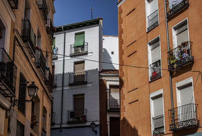 Historical houses in madrid, spain, europe. colorful mediterranean street in lavapiés neighborhood. 