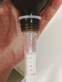 Close-up of hand holding fork