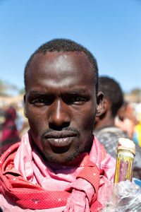 Close-up portrait of man wearing sunglasses against sky