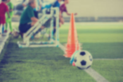 Close-up of soccer ball on field