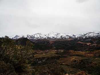 Scenic view of snowcapped mountains against sky