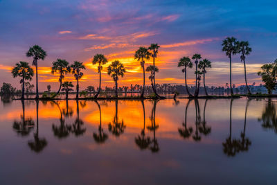 Scenic view of lake against sky during sunset