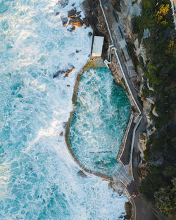 Ocean rockpool with turbulent waves